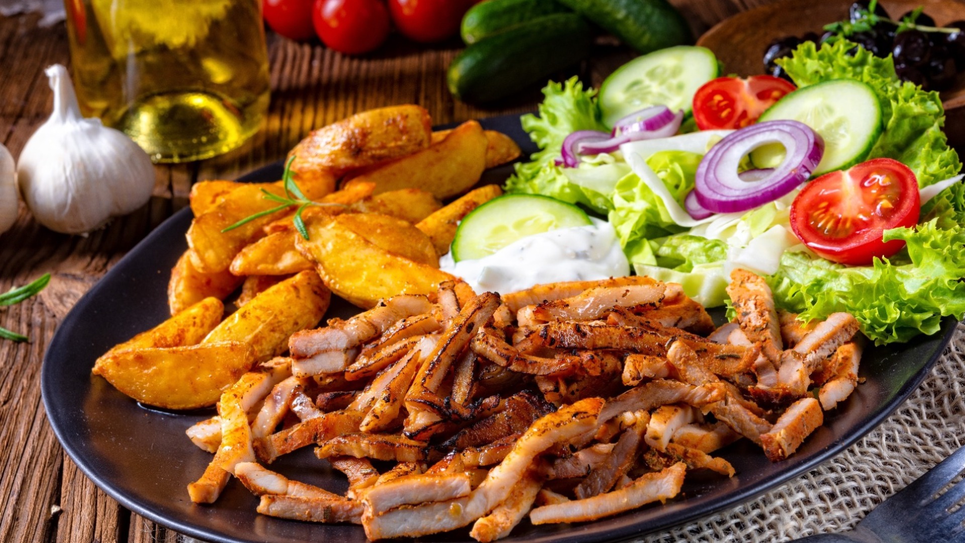 Rustic gyros plate it green salad and potato wedges